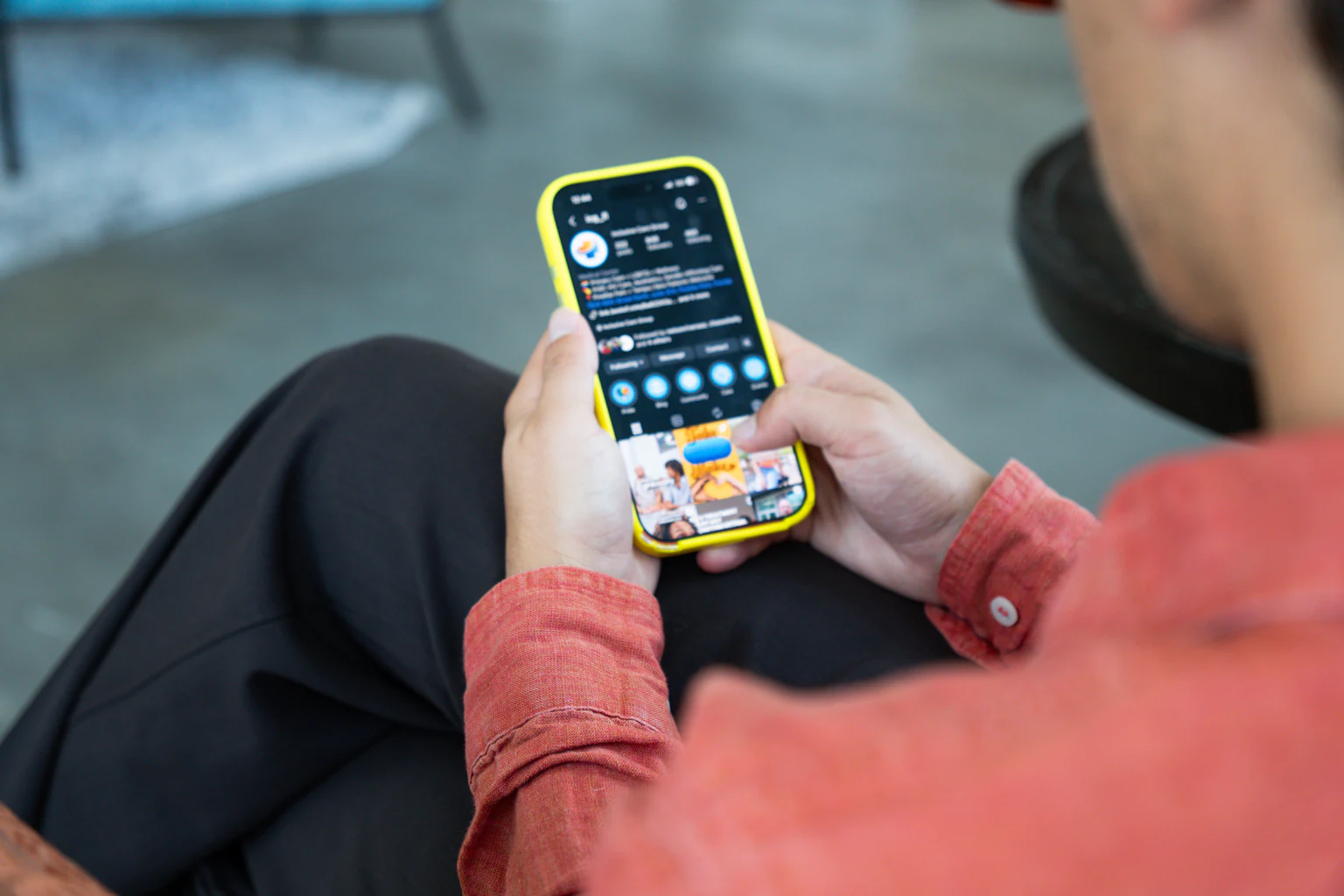 Checking a client's Instagram profile on a phone during social media management