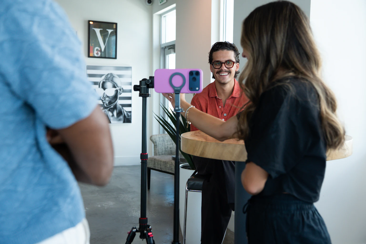 Jada Andreozzi directing a talking-head video with a phone on a tripod