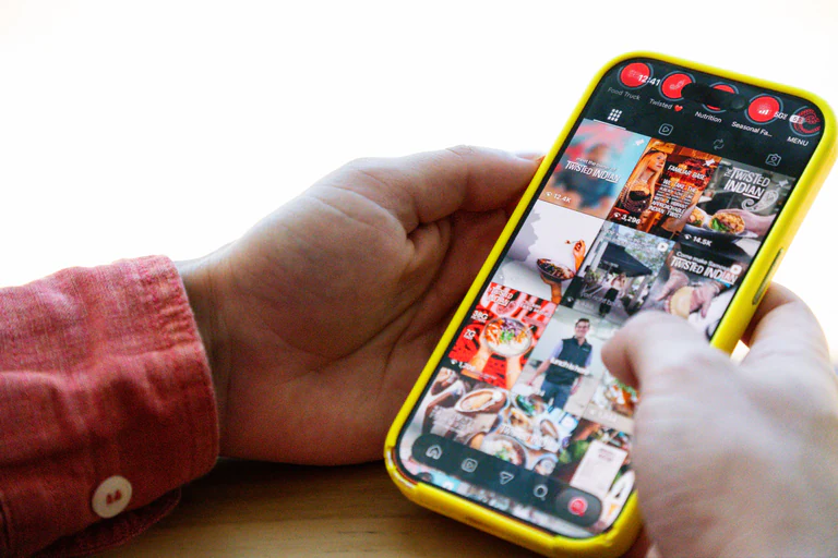 Instagram grid of short-form food content for Twisted Indian open on a phone