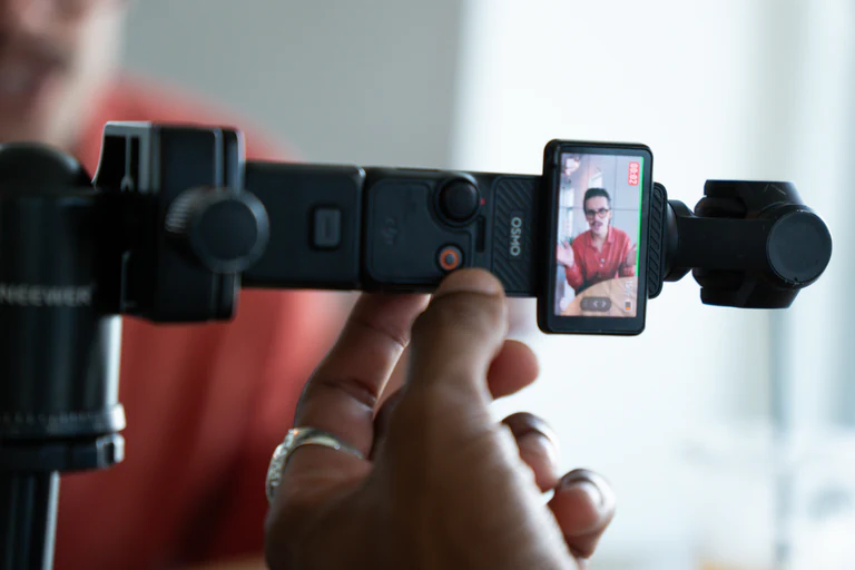 Framing a vertical short-form video on a phone gimbal during a content shoot